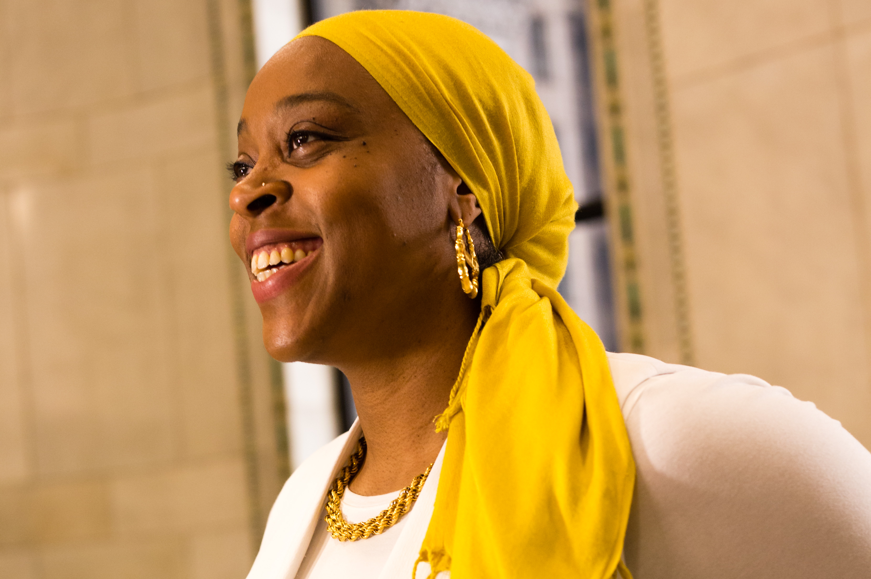 woman in yellow head scarf